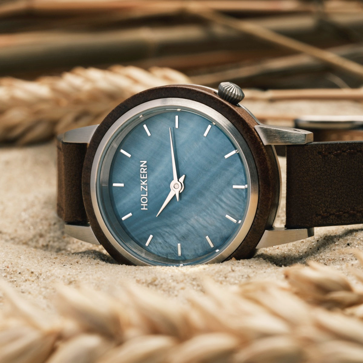 "Côte d'Azur" watch featuring a walnut case and nacre face, showcasing a stylish coastal design.