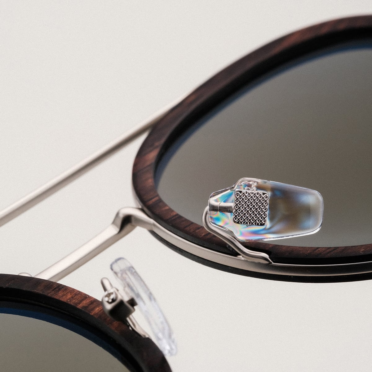"The Enchanting" sunglasses featuring a Leadwood frame with antique silver accents for a stylish and elegant look.