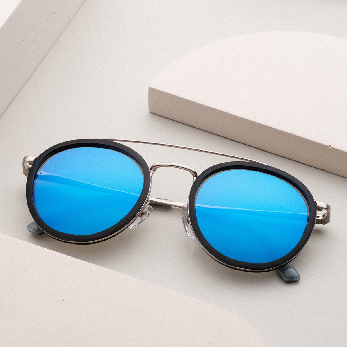 "The Enchanting" sunglasses, featuring a Leadwood and Antique Silver design with a modern, stylish look.