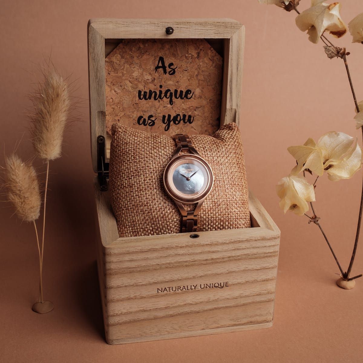 "Fatima" watch in Walnut and nacre with elegant, rustic style displayed in a wooden box.