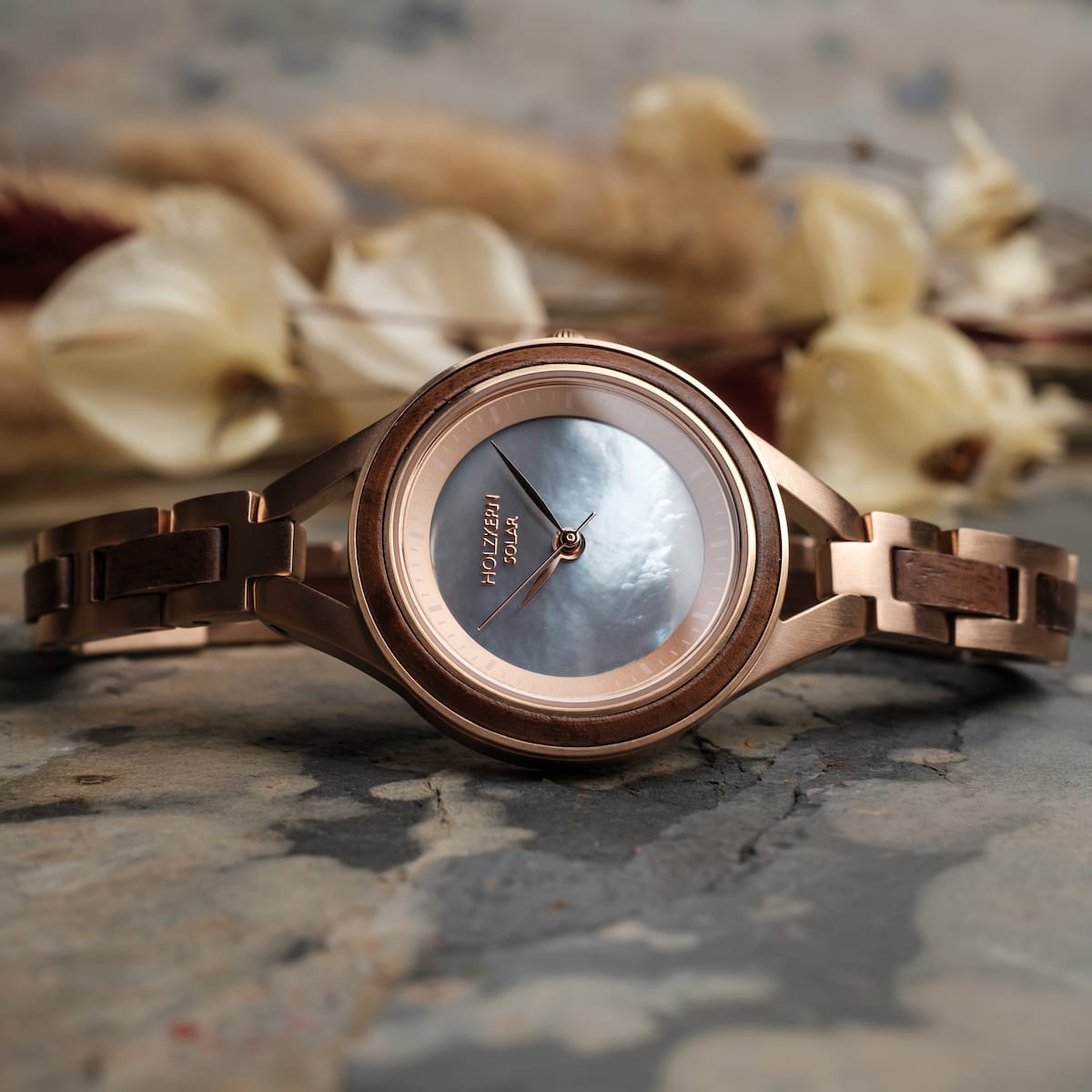 "Fatima" watch with walnut and nacre design, featuring a sleek and sophisticated style.