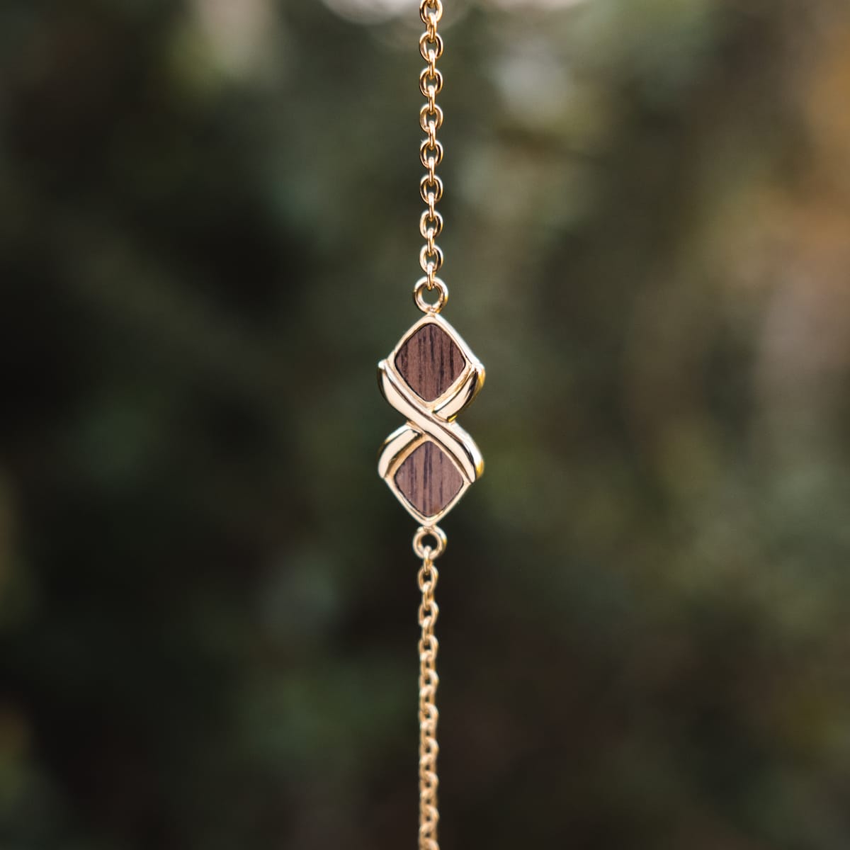 "Mosaic Bracelet", a stylish walnut and gold bracelet with a mosaic design.