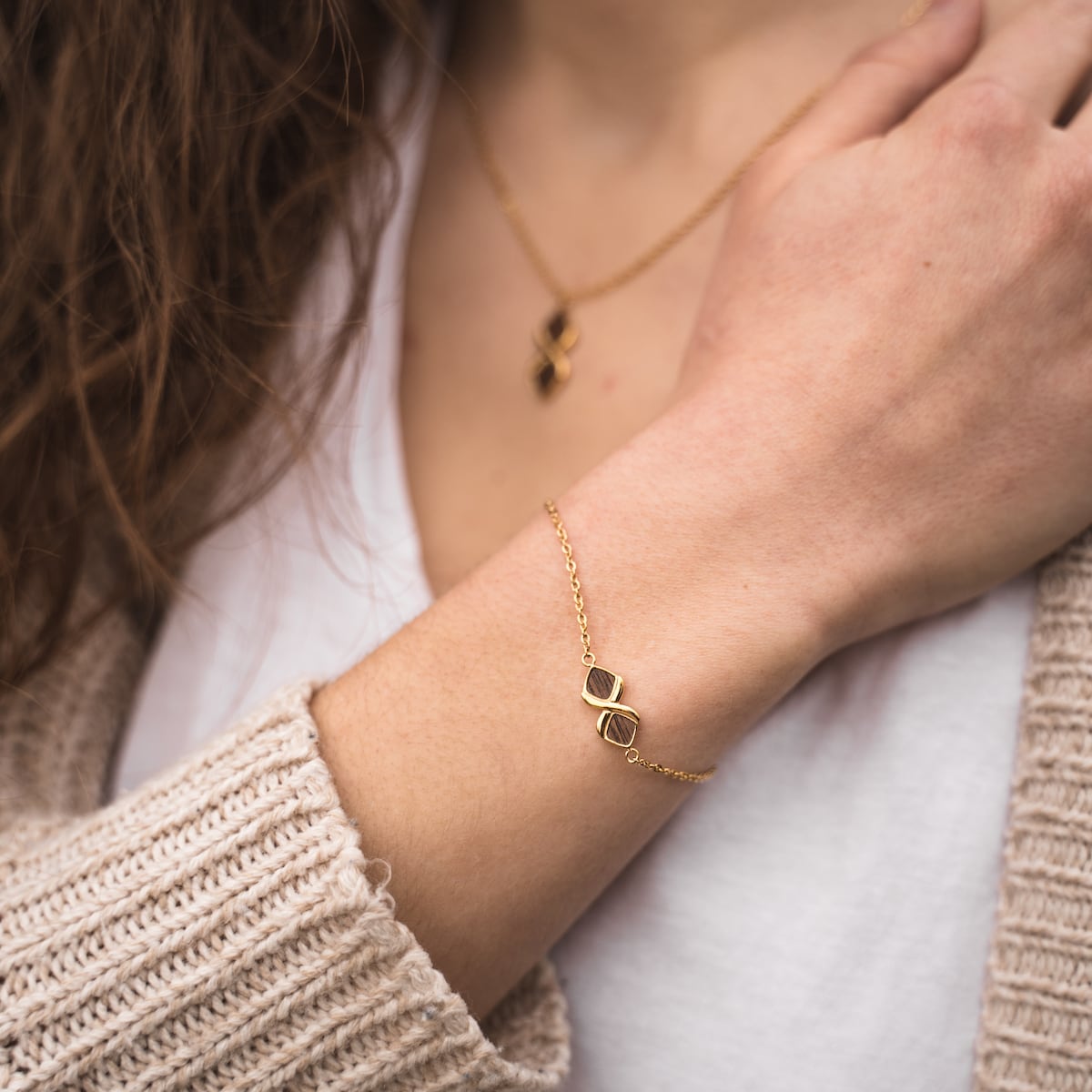 "Mosaic Bracelet" bracelet showcasing a modern walnut and gold mosaic design on a delicate chain.