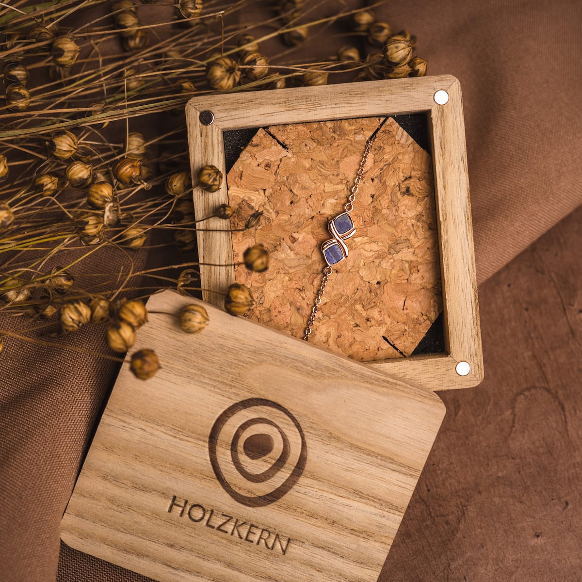 "Mosaic Bracelet" bracelet, featuring a stylish mosaic design with lapis lazuli and rose gold accents, displayed in a wooden box.