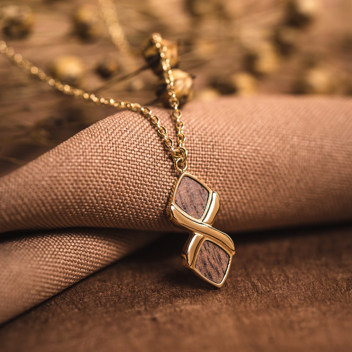 "Mosaic Necklace": Elegant walnut and gold necklace with a modern mosaic style.