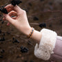 "Fantasia" bracelet in olivewood and blue, featuring a sleek and modern design.