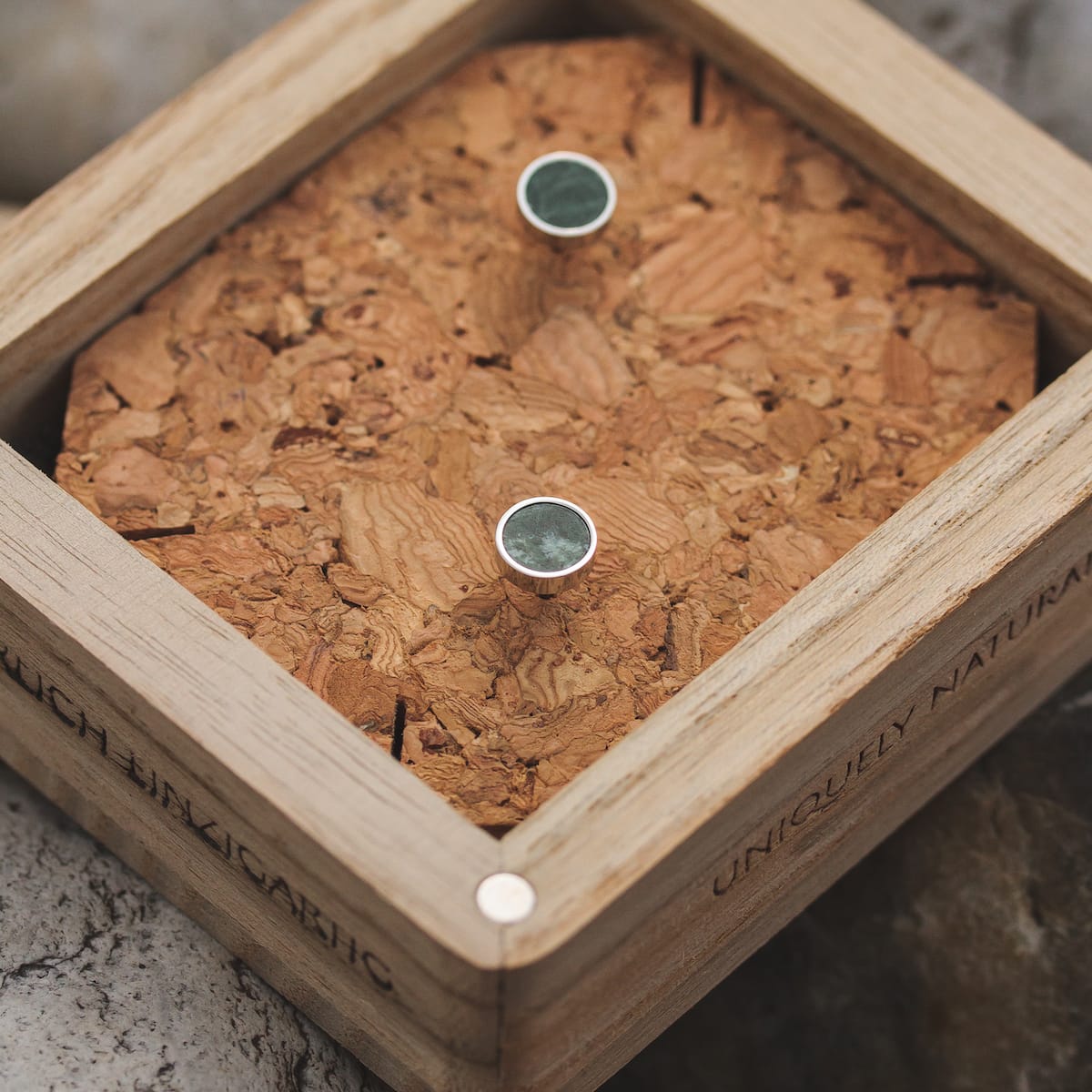 "Concentric earrings" earrings featuring a concentric design with marble and silver accents, elegantly displayed in a wooden box.