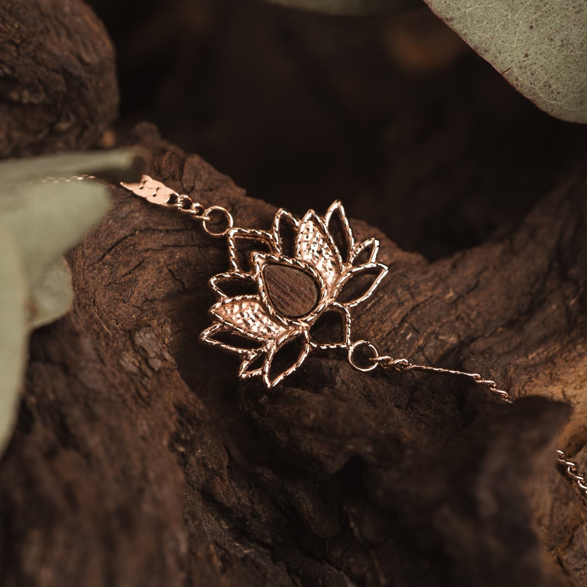 "Balance Bracelet", a stylish bracelet featuring walnut and rose gold, set against a natural background.