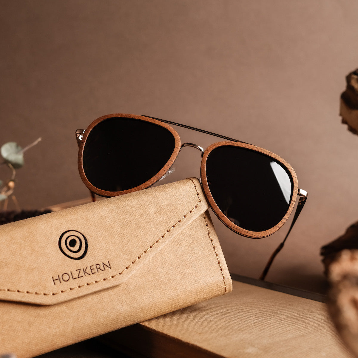 "The Honorable" sunglasses with teak and matte gold finish, featuring a sleek and sophisticated design.