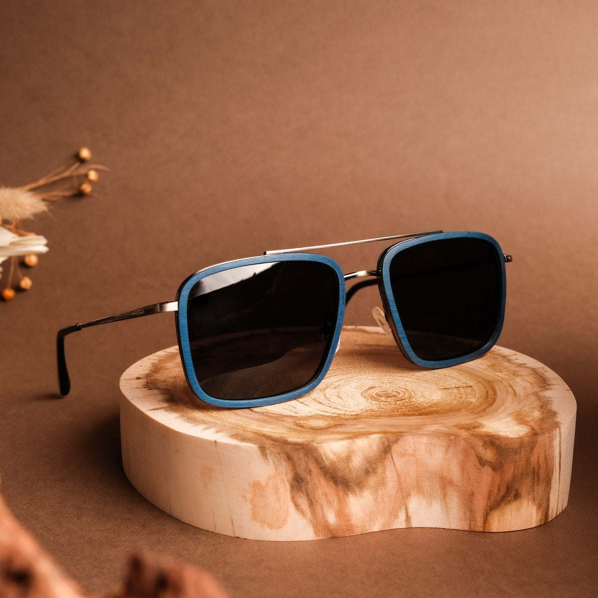 "The Prominent" sunglasses with a sleek, modern design in maple and dark grey tones.