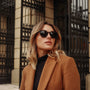 "The Comedian" sunglasses exude a stylish, modern appeal with leadwood frames and khaki dust lenses.