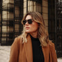 "The Logician" sunglasses feature a sleek style with Leadwood frames and Antique Silver accents.