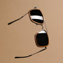 "The Logician" sunglasses featuring a stylish zebrawood frame with dark grey accents.
