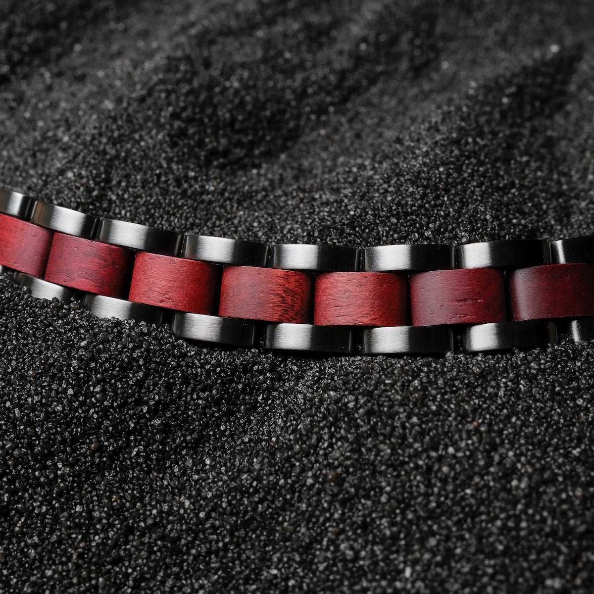 "Triad" bracelet, featuring a striking amaranth and gray design, with a modern and elegant visual style.