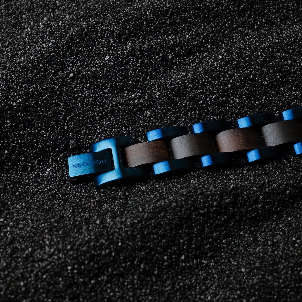 "Triad" bracelet featuring a dynamic Maple/Blue color scheme on a textured dark surface.