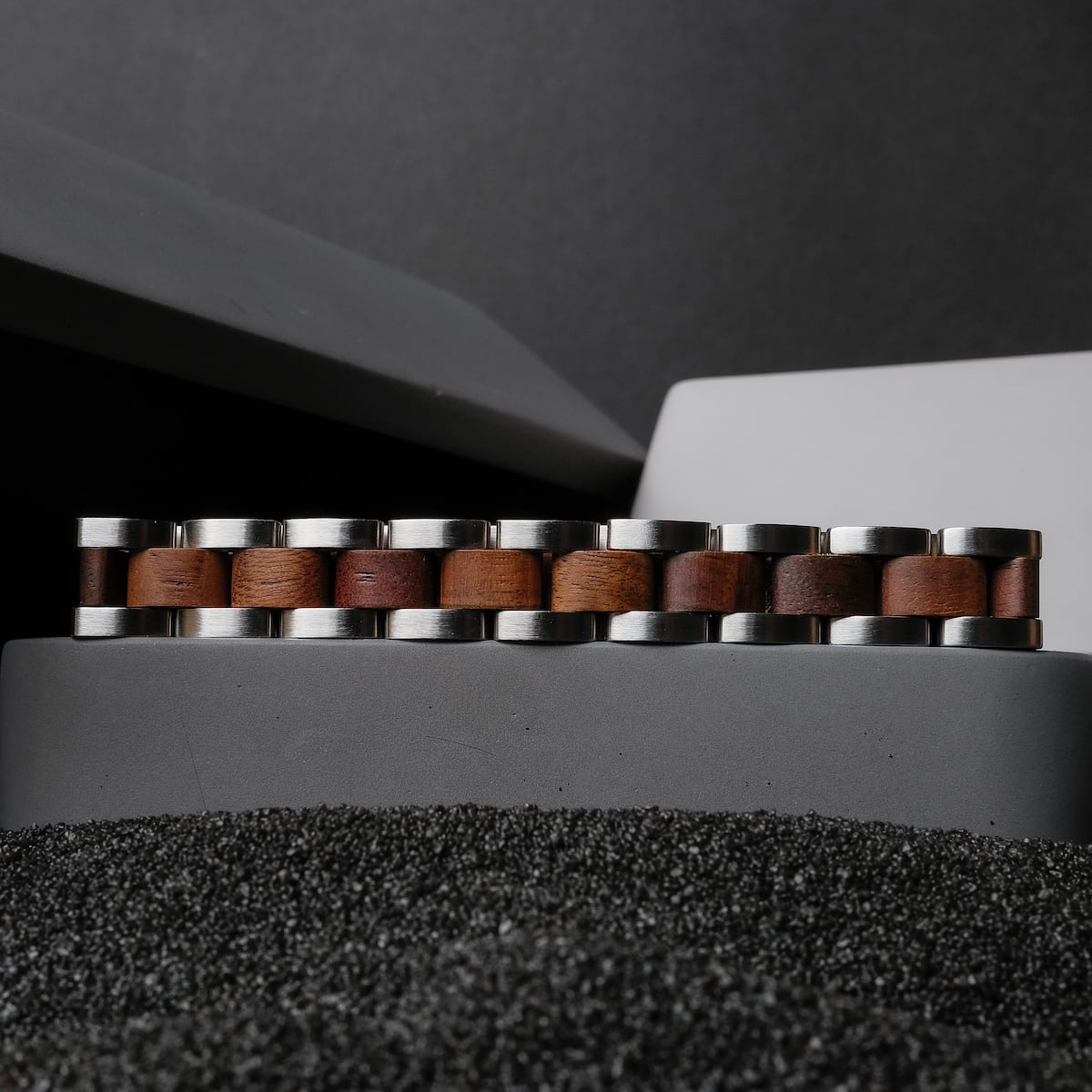 "Triad" bracelet in Walnut and silver, featuring a modern and sleek design.