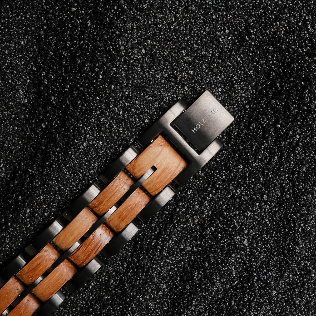 "Kanon", a stylish watch with oak and gray accents on a textured background.