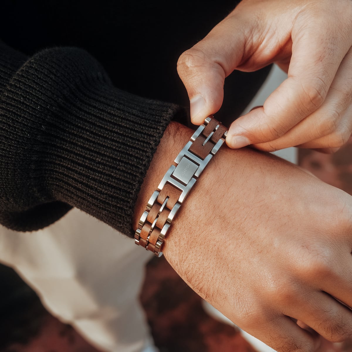 "Kanon" bracelet featuring a stylish blend of walnut wood and silver metal left.