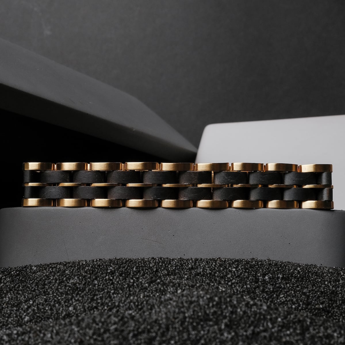 "Kanon" bracelet featuring a sleek black maple and gold design, showcasing elegant craftsmanship.