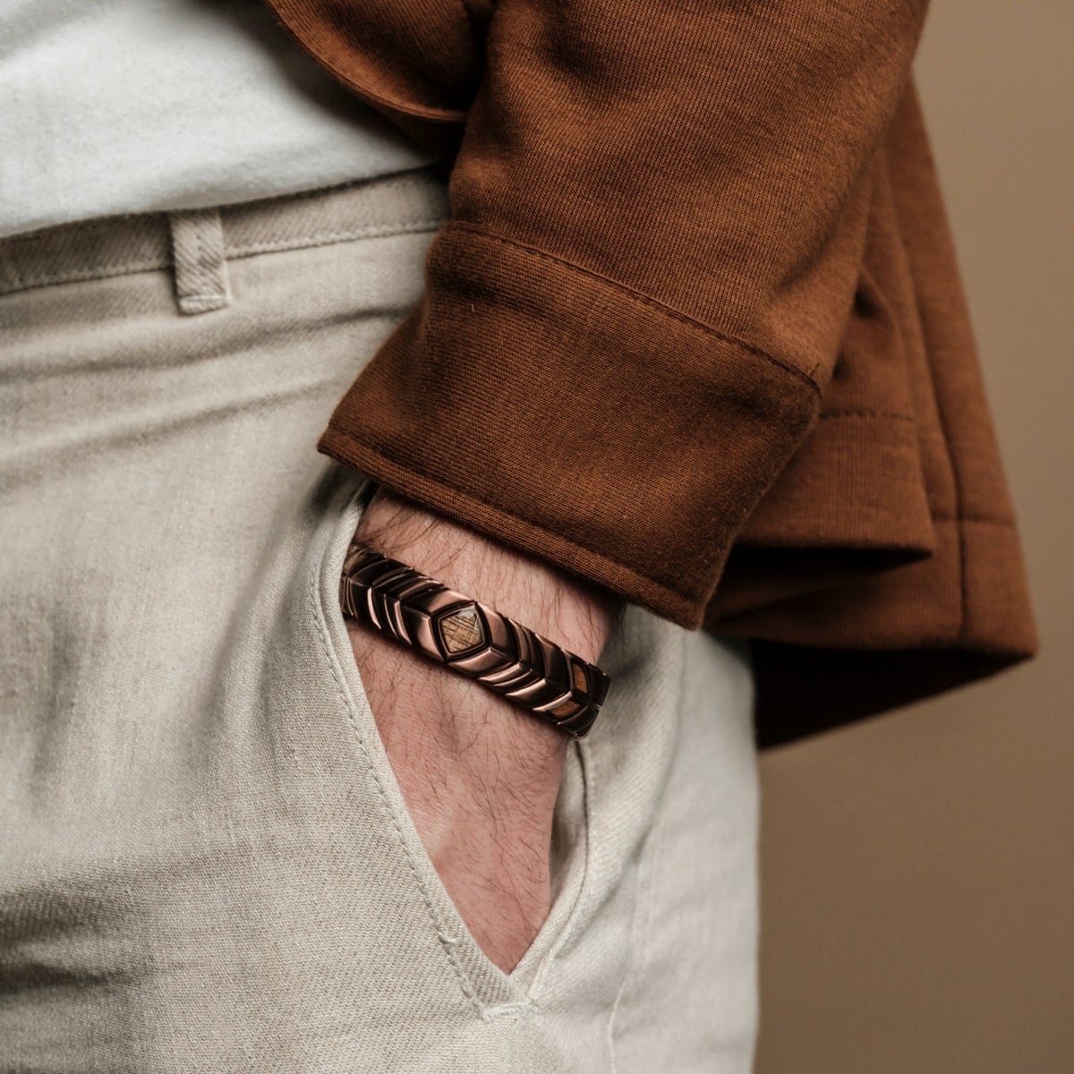 "Prelude" bracelet in walnut and copper, showcasing a sophisticated, earthy style.