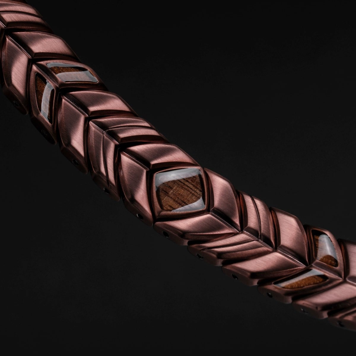 "Prelude" bracelet featuring a walnut and copper design with an elegant, textured style.