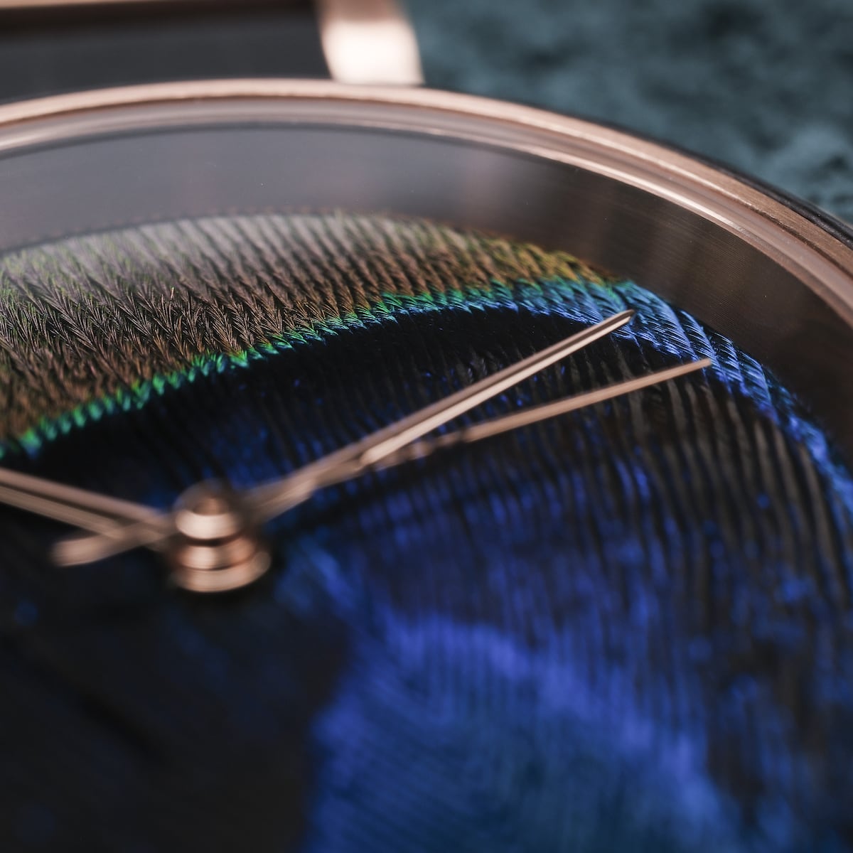 "The Fearless" watch with maple and peacock feather design, featuring elegant bronze hands and vibrant colors.