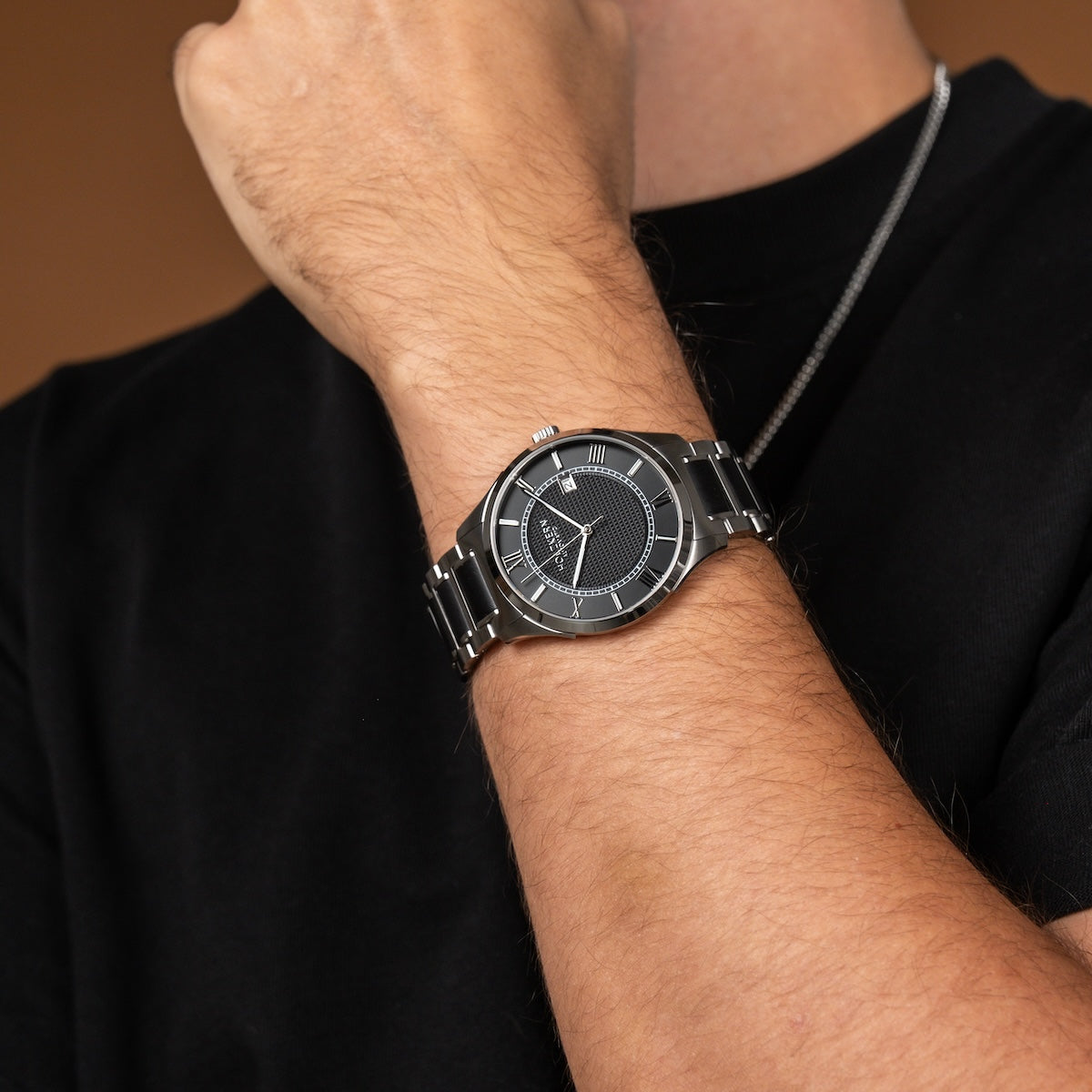 "Milestones" watch featuring a sleek silver and black design with a modern aesthetic.