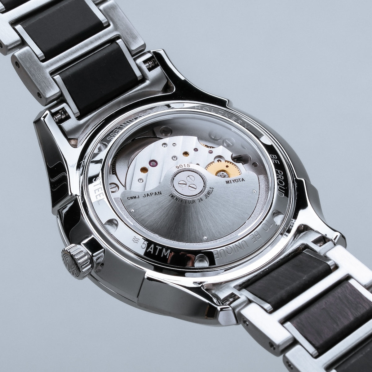 "Milestones" watch with a maple and black bracelet, showcasing a sleek and modern style.