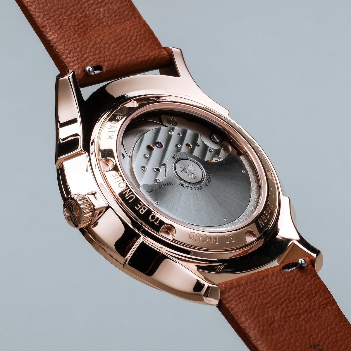 "Milestones", watch, featuring a nacre dial and brown leather strap with a sleek, modern design.