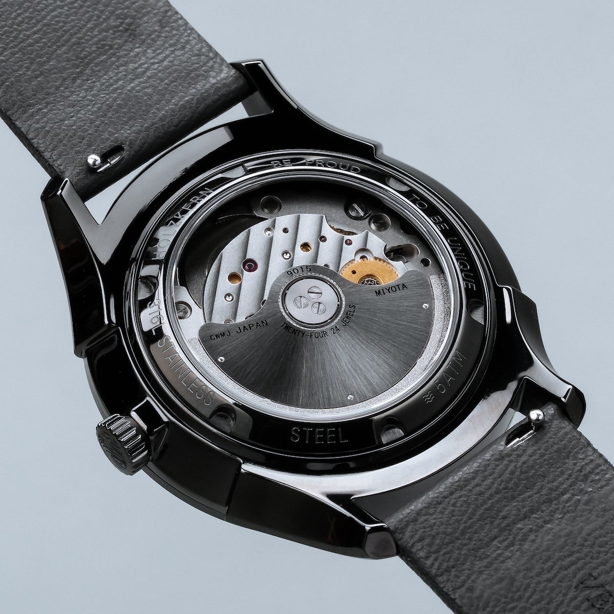 "Milestones" watch, featuring a nacre dial and dark gray strap, showcasing an elegant mechanical style.
