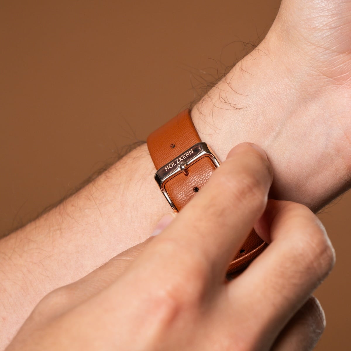 "Milestones" watch with a brown leather strap and nacre accents, showcasing stylish and elegant design elements.