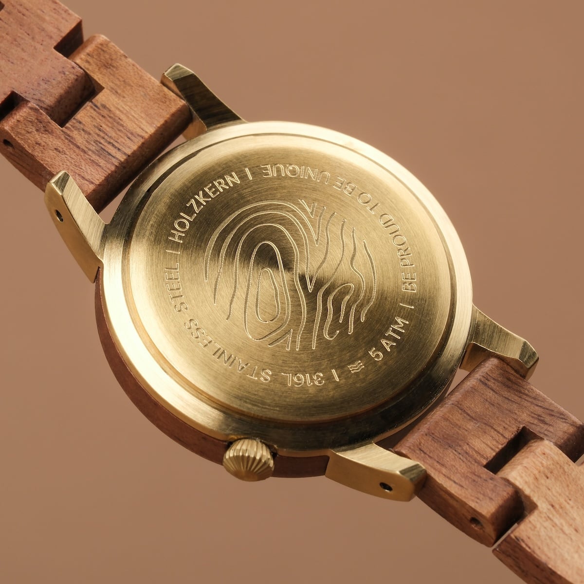 "Antrim" watch featuring a wooden band and engraved brass back for a natural, elegant look.