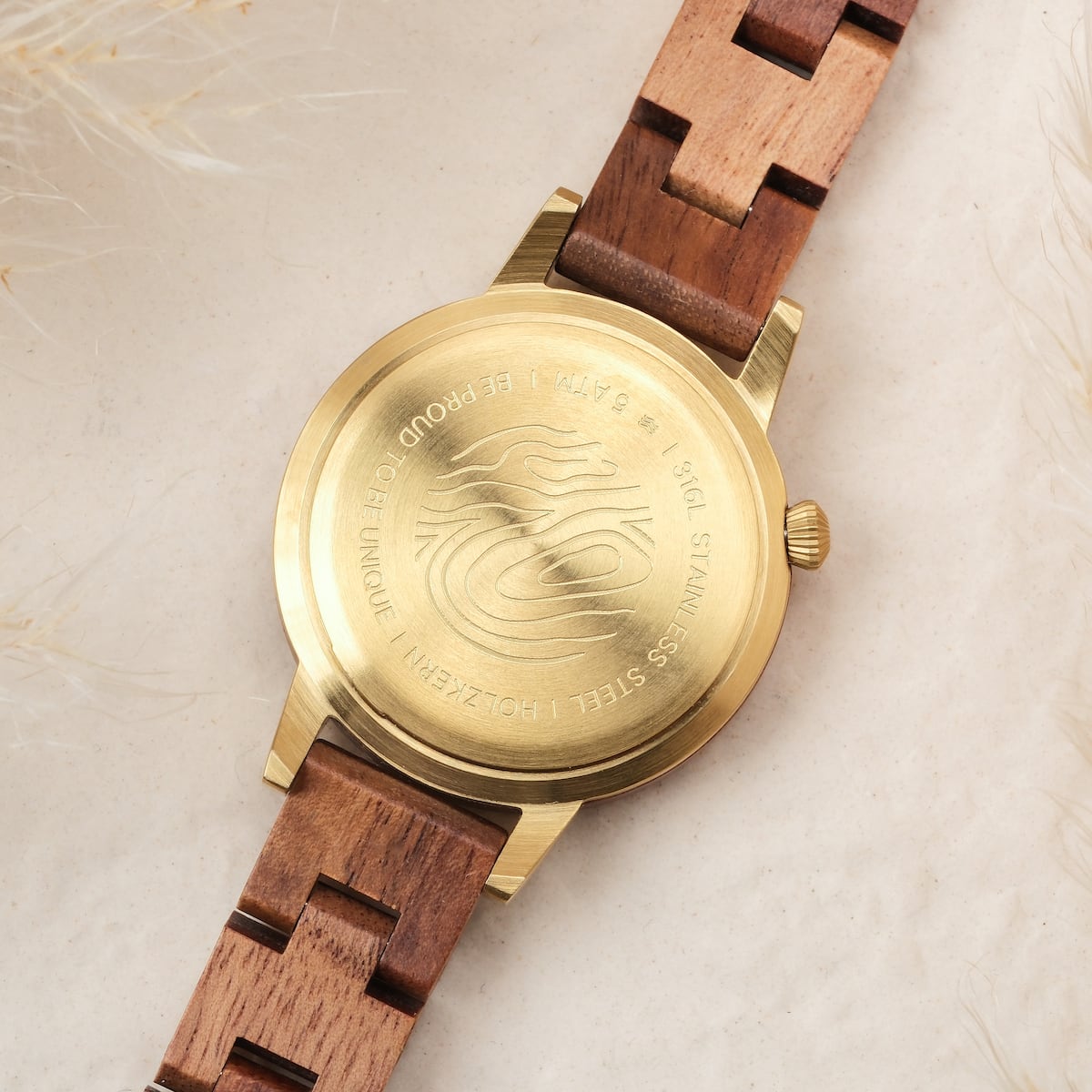 "Costa del Sol" watch featuring koa wood and Tiger's Eye accents, showcasing a stylish, natural aesthetic with a gold-tone case.