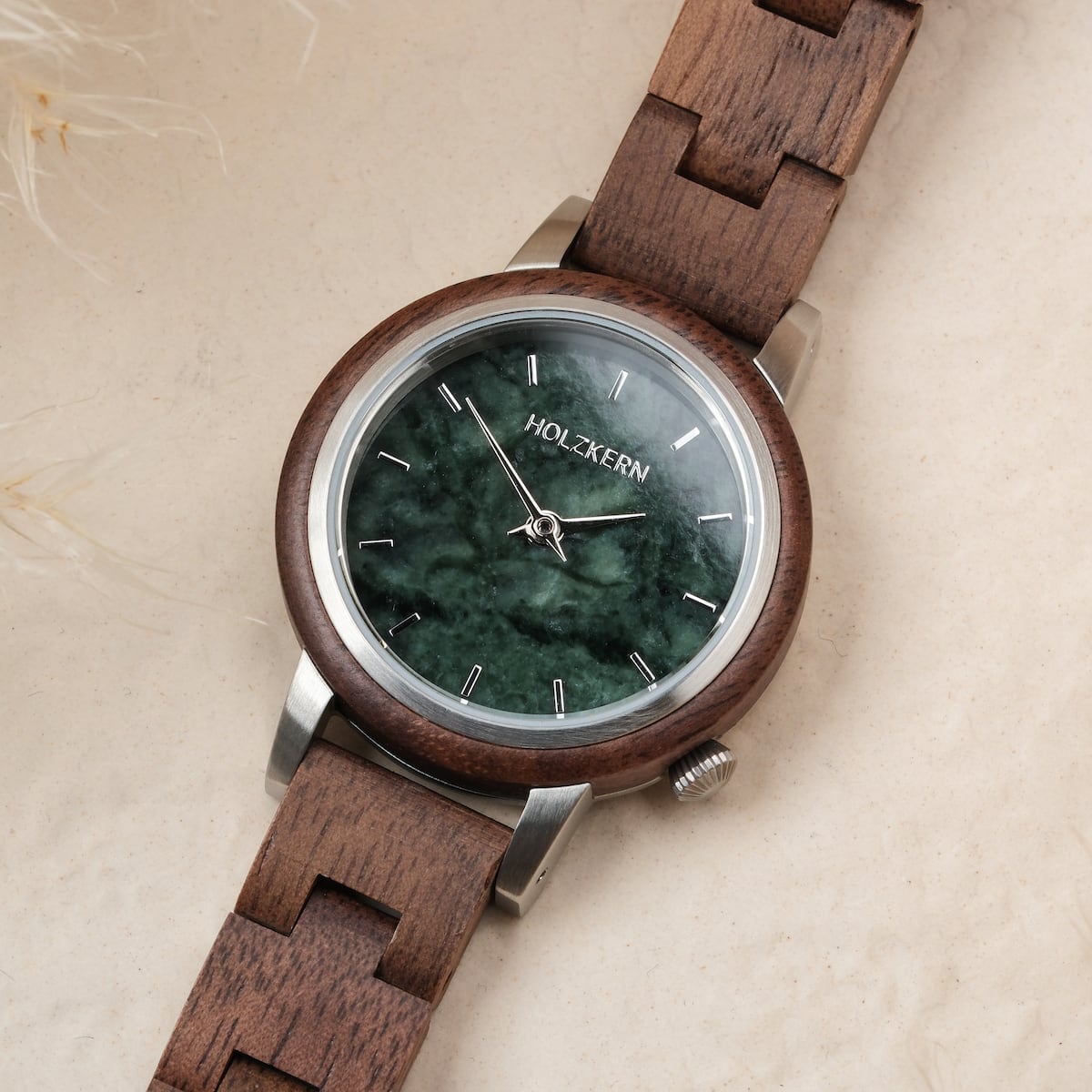 "Anakena" wooden wristwatch featuring walnut and marble design with a natural and elegant style.