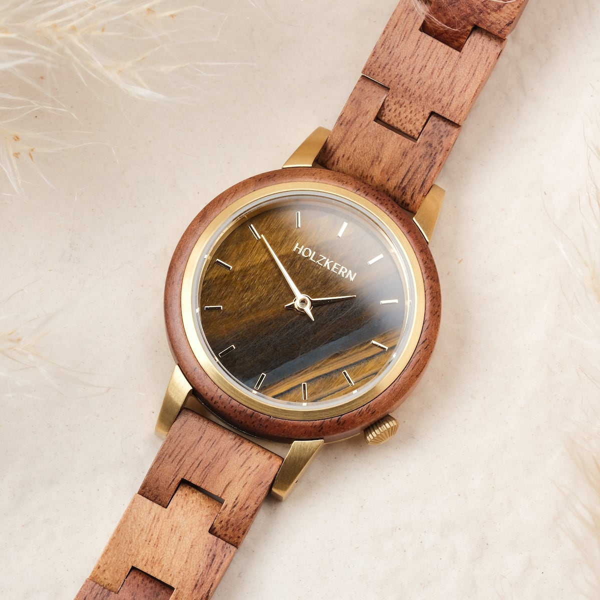 "Costa del Sol" watch with koa wood and tiger's eye accents, featuring a natural, elegant design.