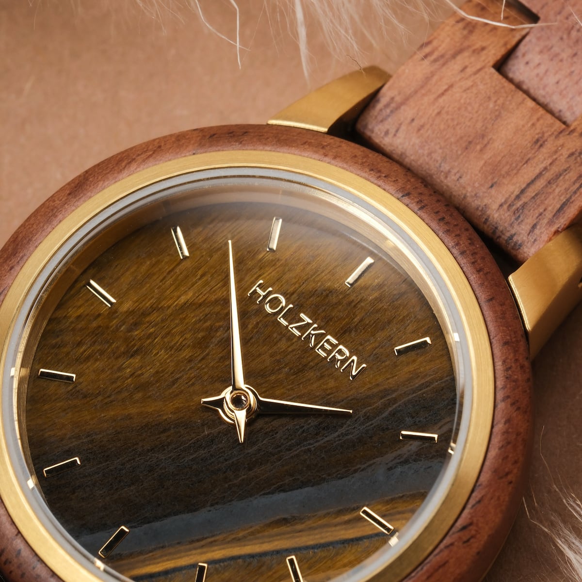 "Costa del Sol" watch featuring a koa wood and tiger's eye design with a sleek, natural aesthetic.