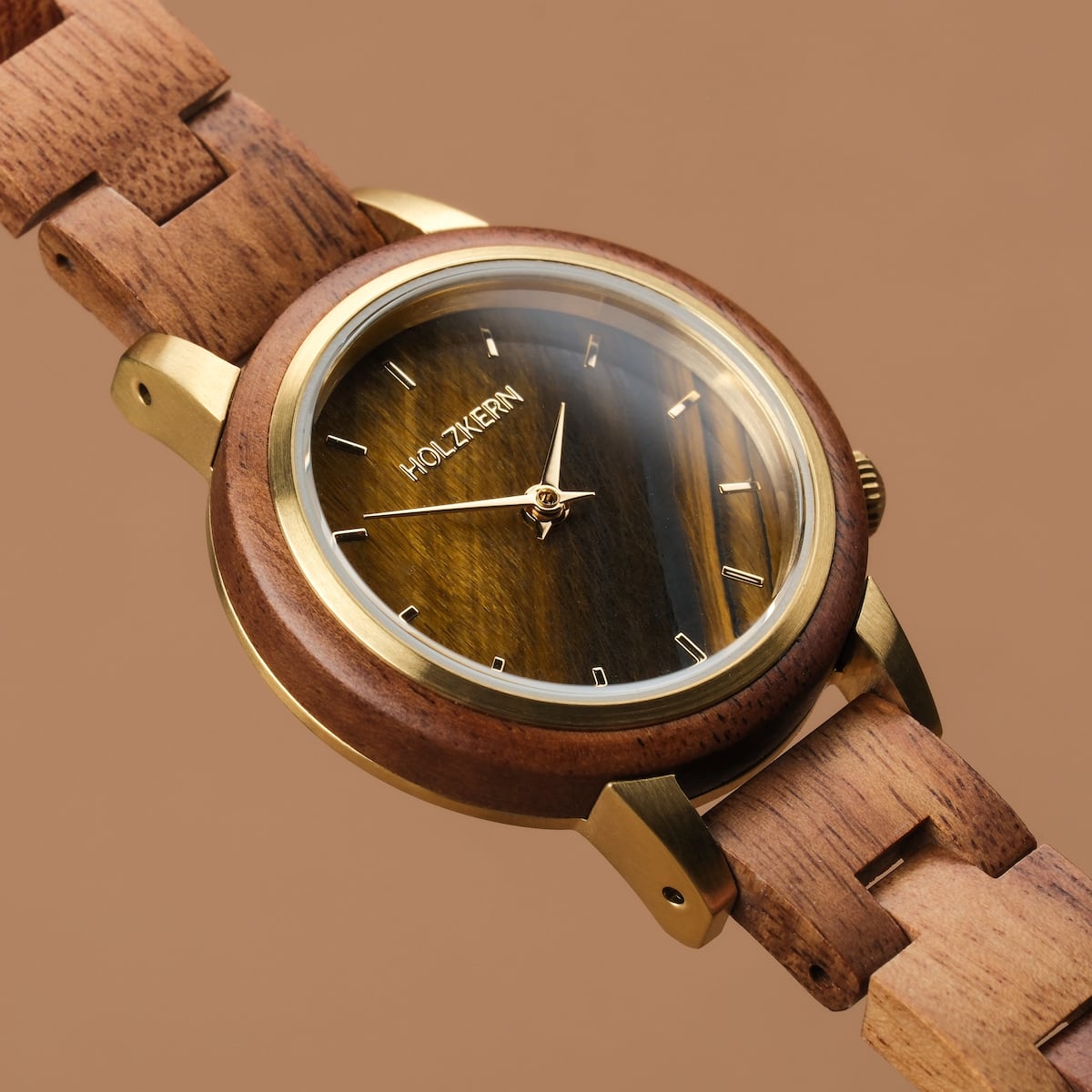 "Costa del Sol" wooden watch featuring a gold-tone bezel and tiger's eye face on a koa wood strap.