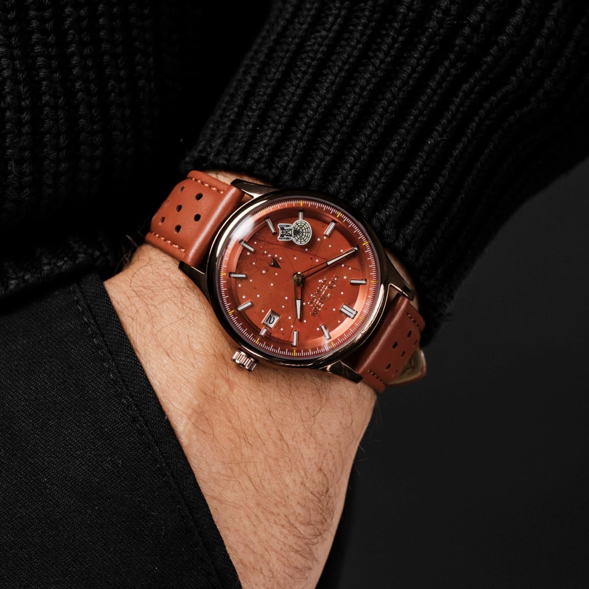 "NCC-1701-D" watch featuring a jasper-colored dial and red leather strap, blending elegance with a modern aesthetic.