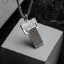 "Transcendent" pendant featuring a sleek slate and silver design with a modern, textured aesthetic.