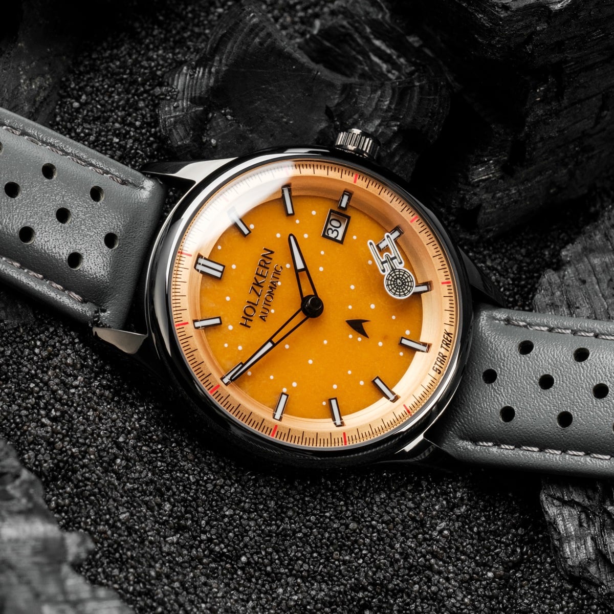 "NCC-1701" watch featuring a striking orange dial with jade and dark gray accents.