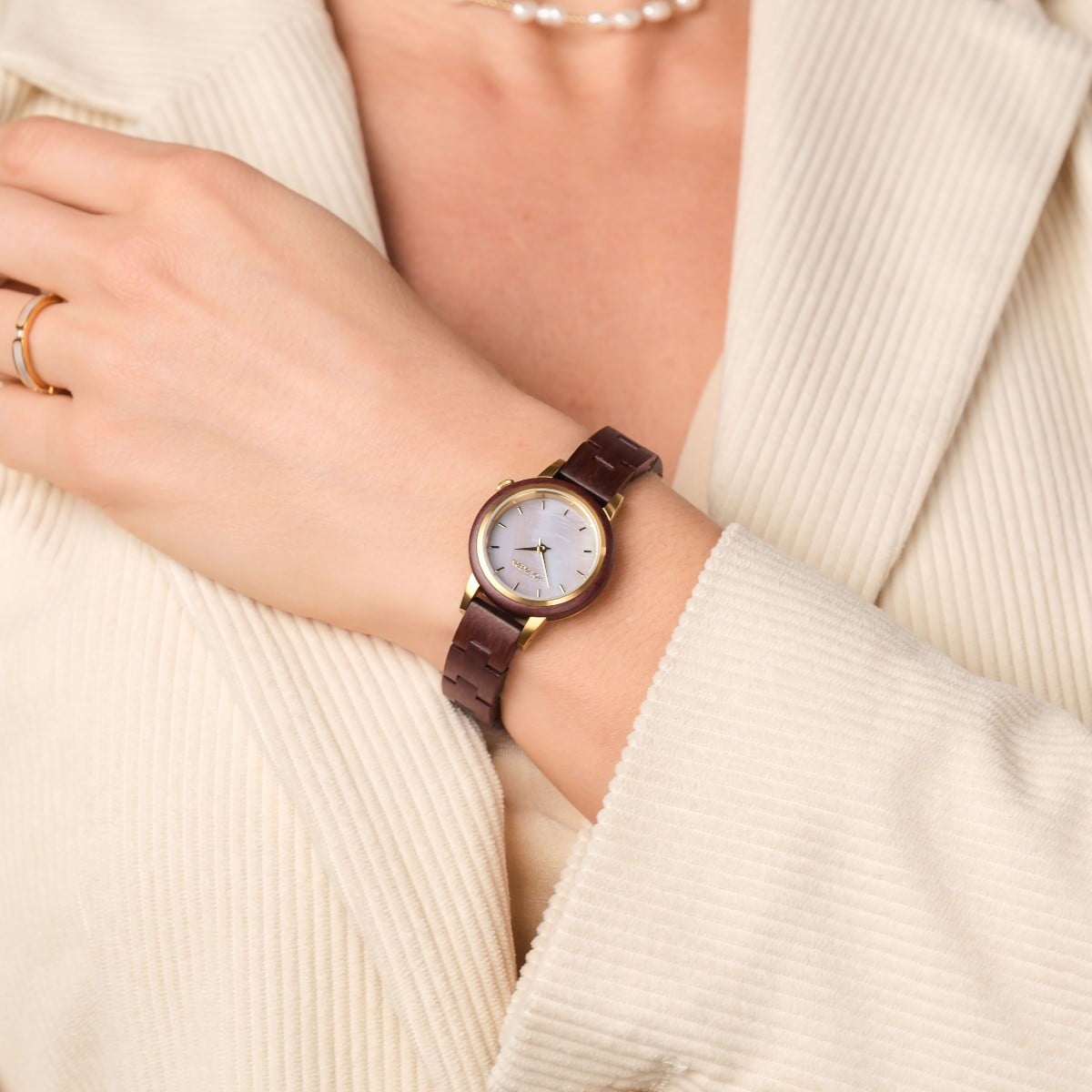 "Napali" watch with amaranth strap and nacre face, featuring a stylish and elegant design.
