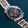 "Oscar" watch with walnut accents, blue dial, and a sleek, modern design.