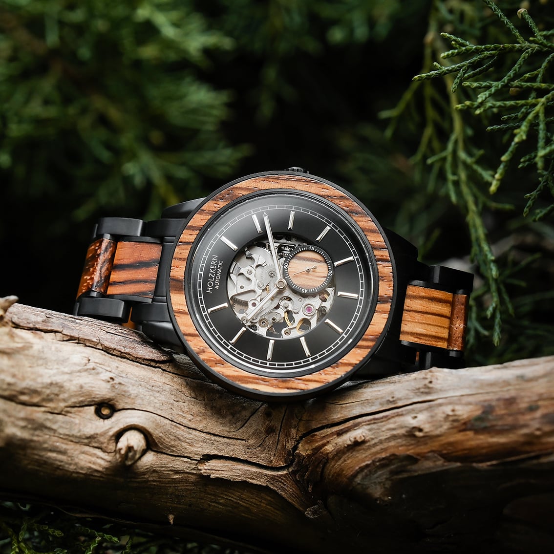 "San Juan" watch featuring zebrawood accents with a black and silver dial, showcasing intricate mechanical design.