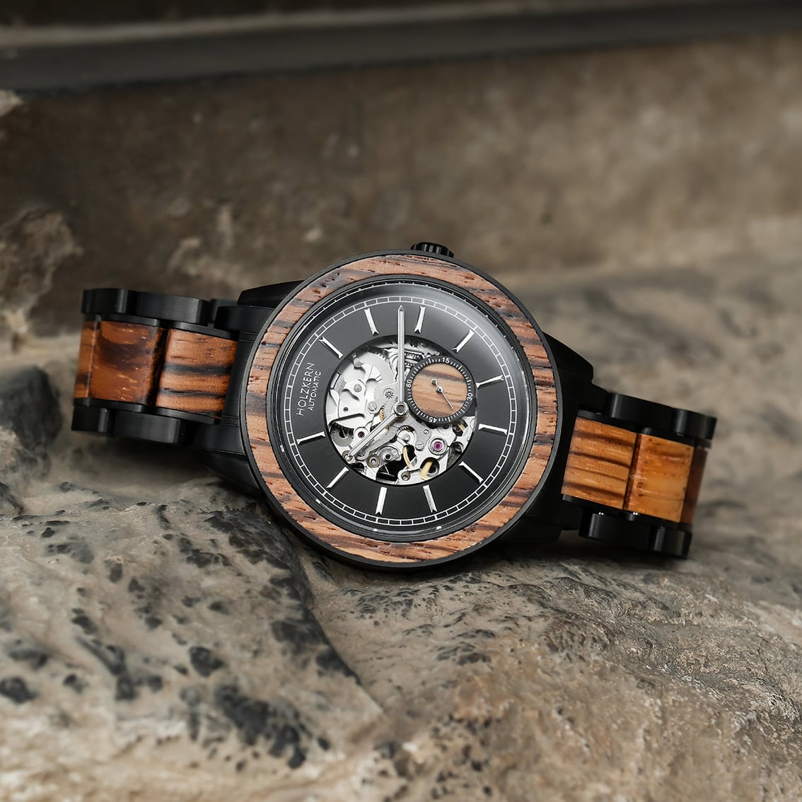"San Juan", a sophisticated wristwatch featuring rich zebrawood highlights and a modern design.