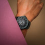 "Flowfinder" watch, featuring a sophisticated maple and dark gray design.