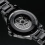 "Flowfinder" watch in maple/dark gray, featuring a mechanical design with a sleek and modern style.