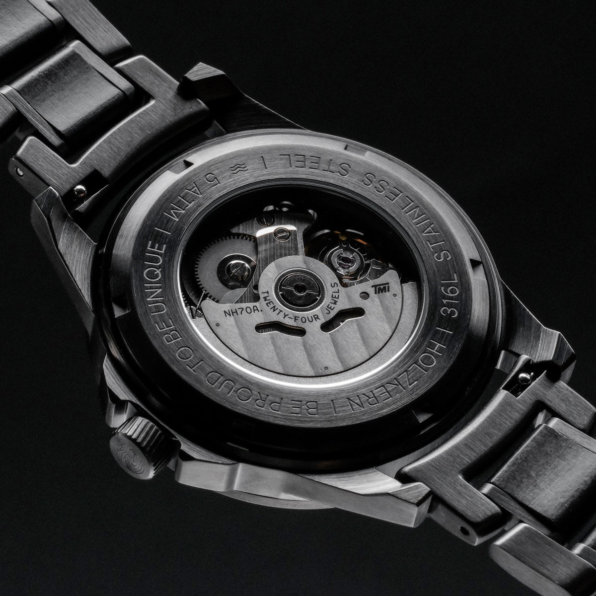 "Flowfinder" watch in maple/dark gray, featuring a mechanical design with a sleek and modern style.