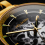 "Flowfinder", Maple/Gold watch with a sophisticated matte black dial and golden accents.