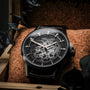 "Flowfinder" watch, featuring a stylish maple and dark gray design.