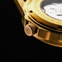 "Flowfinder", a stylish watch in maple and gold tones with intricate detailing.
